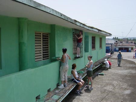 Painting a health clinic in Caimito